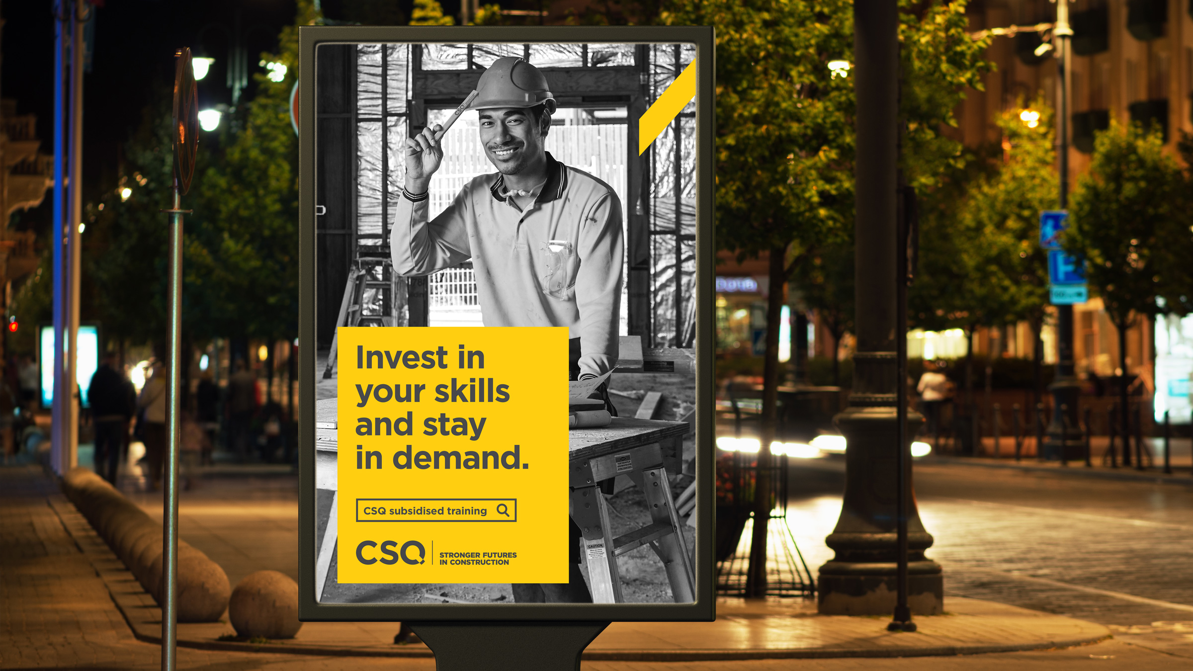 An out of home bus stop ad part of the CSQ advertising campaign. It features a tradie tapping his hard hat with a pencil. The copy reads "Invest in your skills and stay in demand