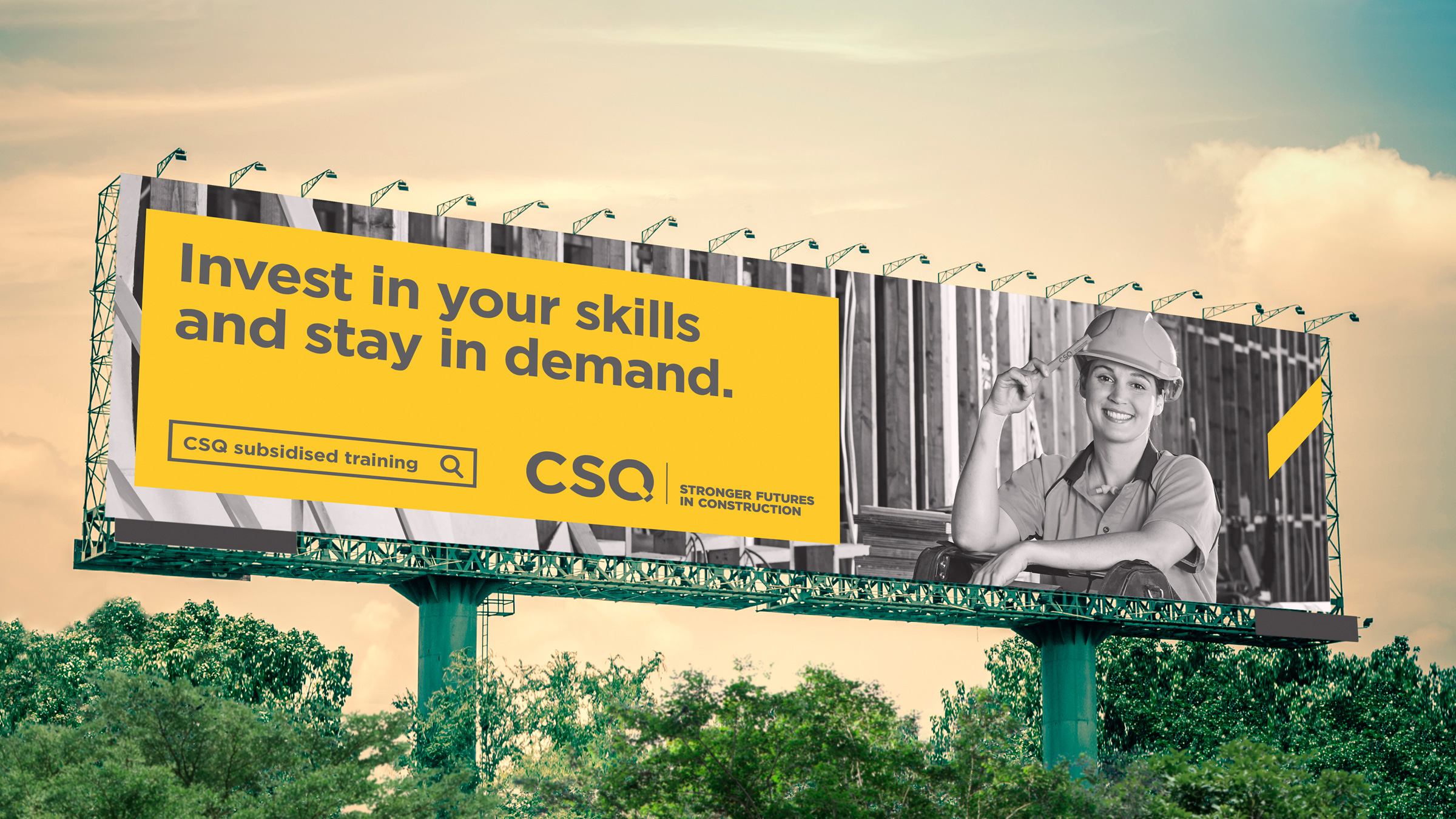 A billboard ad part of the CSQ advertising campaign. It features a tradie tapping her hard hat with a pencil. The copy reads "Invest in your skills and stay in demand